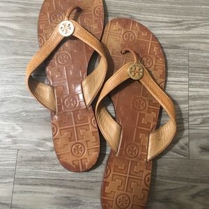 Tory Burch gold leather flip flops